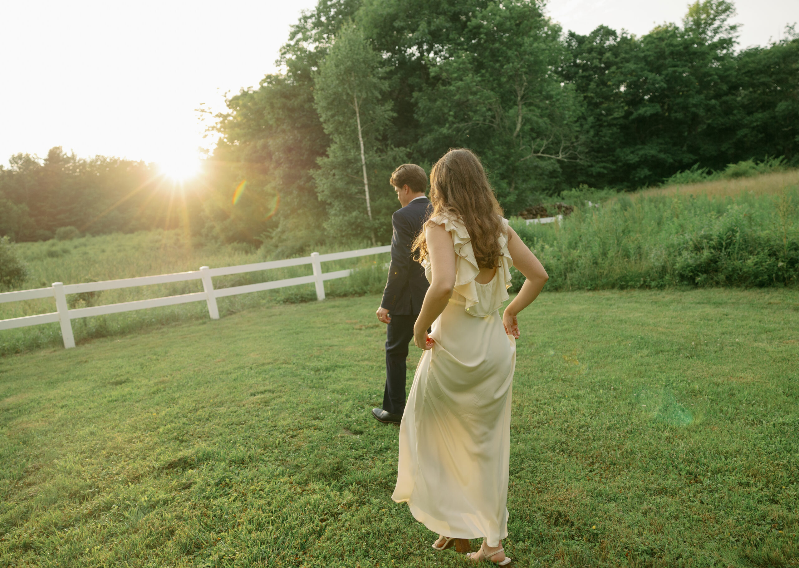 Bride and groom embracing on the Maine coastline during a sunset wedding – captured by Texas-based wedding photographer offering services in New England