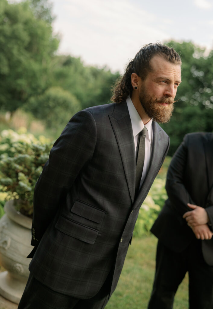 groom waiting at the end of aisle