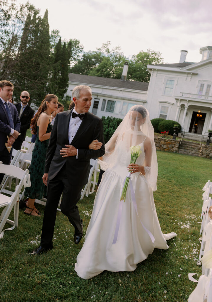 Bride walking down the aisle in coastal Maine wedding